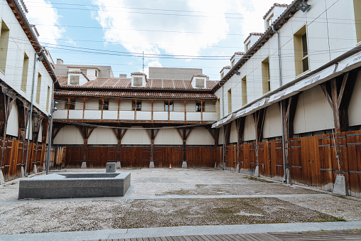 Madrid, Spain - June 2, 2018: Cultural Center La Corrala, actually Museum of Arts and Popular Traditions. The building is a traditional tenement block with communal balconies built around a courtyard.