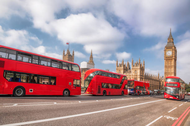 london symbols with big ben, double decker bus and red phone booths in england, uk - big ben london england uk double decker bus imagens e fotografias de stock