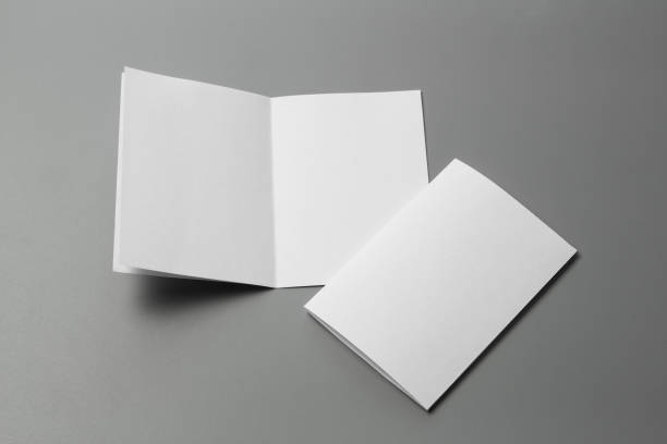 istock Blank portrait mock-up paper. brochure magazine isolated on gray, changeable background / white paper isolated on gray 970717852