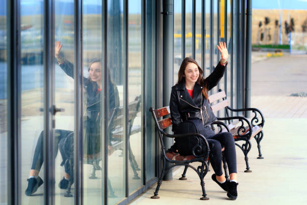 istock Girl sitting on a bench 970732814