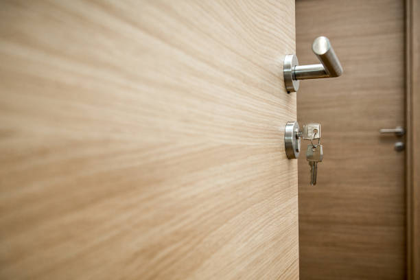 istock door with a key to the new apartment 970736464