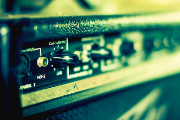 istock Button and adjust the volume control of Keyboard, Guitar, Bass Power Amplifier. 970736478