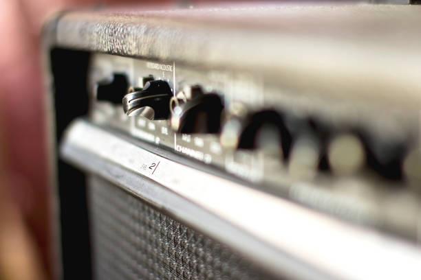 istock Button and adjust the volume control of Keyboard, Guitar, Bass Power Amplifier. 970740238