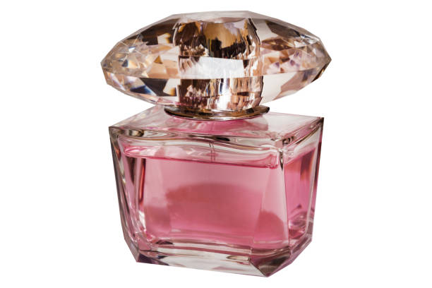 istock Pink female perfume bottle  isolated on the black background 970744088