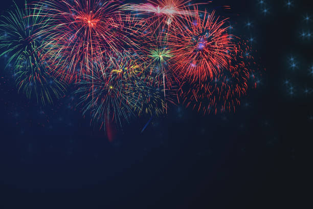 istock Beautiful colorful fireworks background display for celebration and anniversary day with free space for text. 970748890