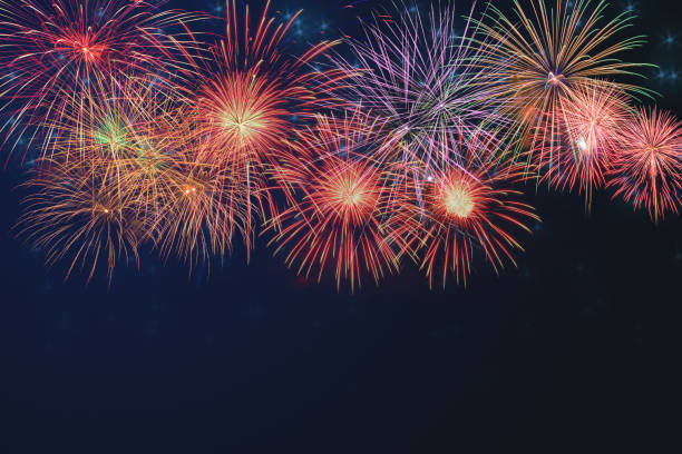 istock Beautiful colorful fireworks background display for celebration and anniversary day with free space for text. 970748894
