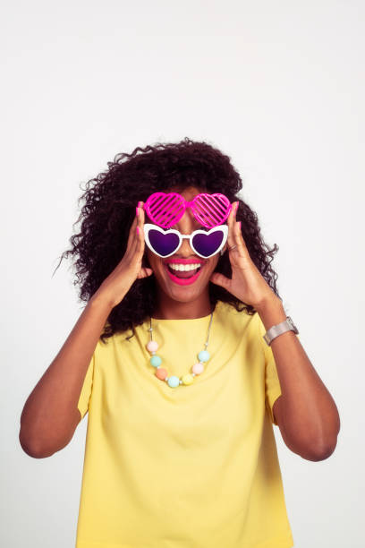 istock Playful woman with double heart-shaped sunglasses. 970753068