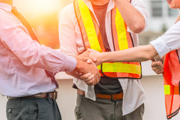istock Engineer Constructor Teamwork Handshaking deal project together with business investor man good relationship concept. 970755476