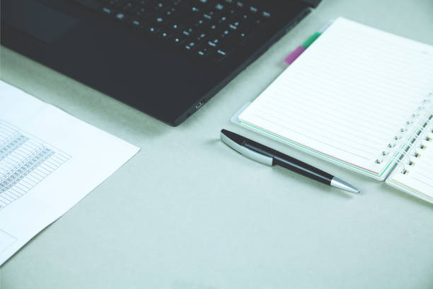istock Laptop, financial document, notepad and pen on desk. Business concept 970761546