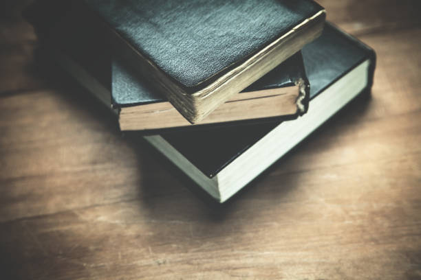 istock Closed Bibles on the wood background. 970761592