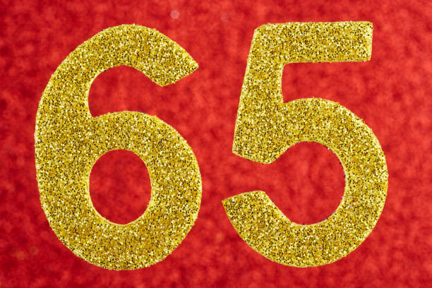 istock Number sixty-five yellow color over a red background. Anniversary. Horizontal 970761692
