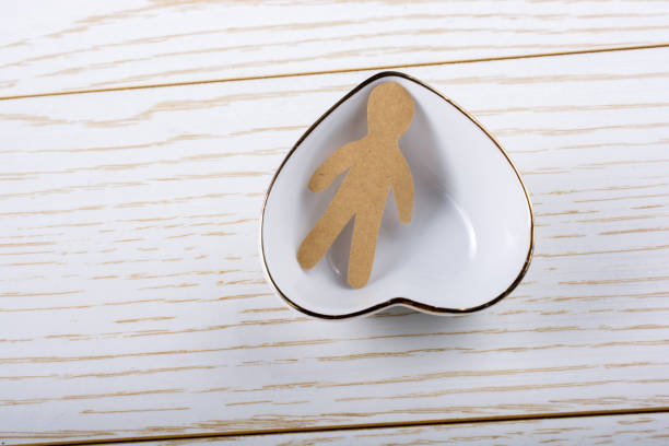 istock Paper man shape in  a heart shaped bowl 970762028