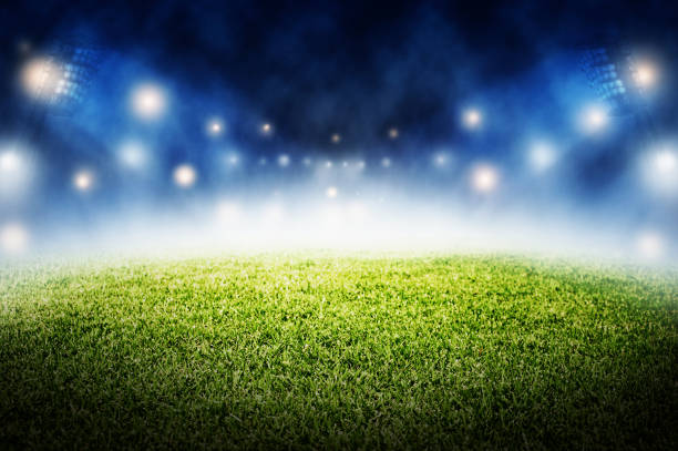 istock soccer field stadium in night time background 970775016