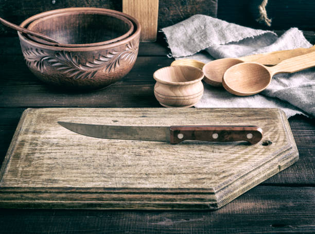 istock old wooden cutting board and knife 970775028