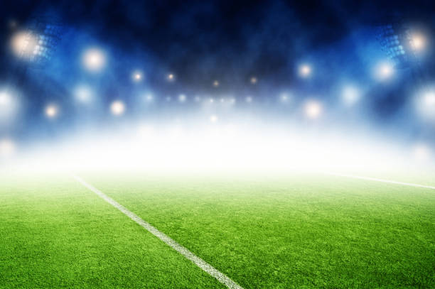 istock soccer field night stadium background 970775072