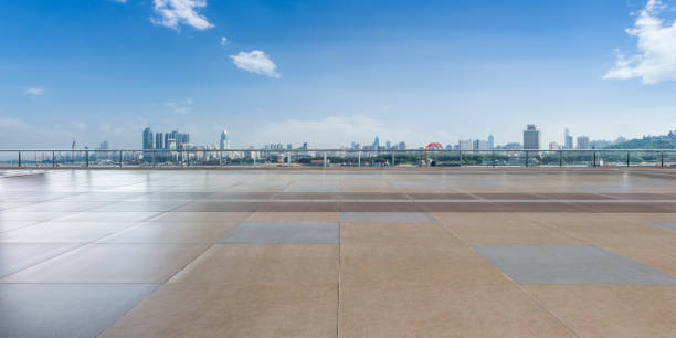 istock Panoramic skyline and modern business office buildings with empty road,empty concrete square floor 970781826