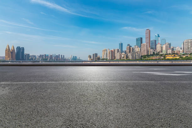 istock Panoramic skyline and modern business office buildings with empty road,empty concrete square floor 970785228