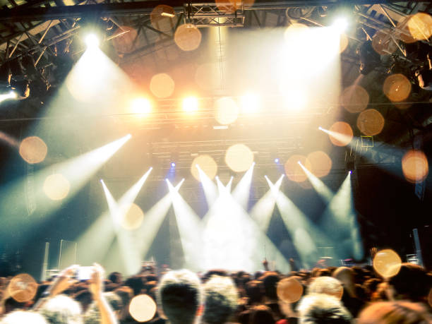 istock Concert hall with a big stage and many fans 970788662