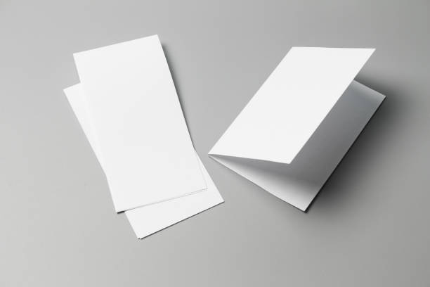 istock Blank portrait changeable background / white paper isolated on gray. identity design, corporate templates, company style, set of booklets, blank white folding paper flyer 970789188