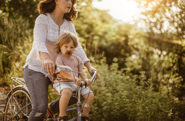 istock Mother Cycling With Her Son in Nature 970792518