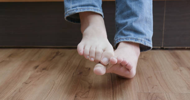 istock man with athlete foot 970799460