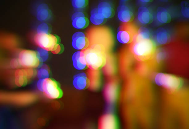 Blurred shot of a group of unrecognizable friends having fun at a nightclub