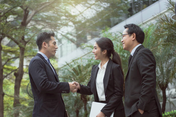 istock Businesspeople making handshake agreement. concept partner for business. 970799636