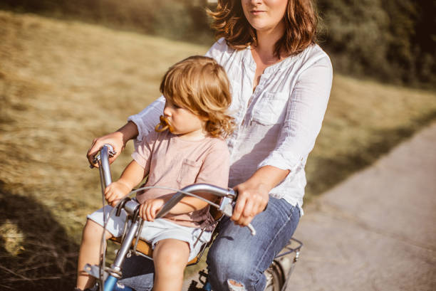 istock Mother Cycling With Her Son in Nature 970802314