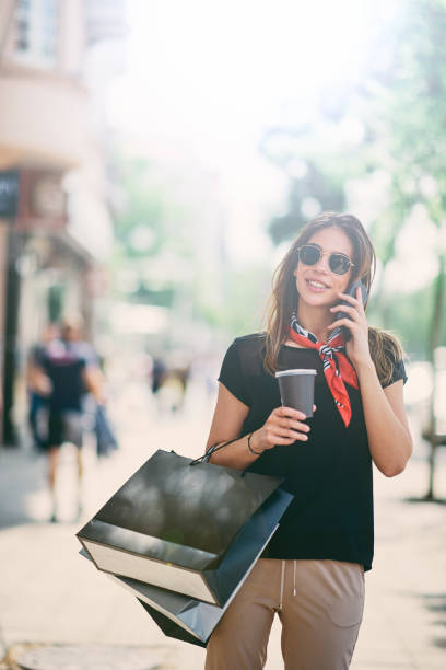 istock Woman walking down the street. 970806366