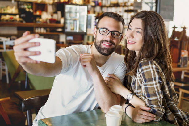 istock Couple Enjoying coffee break with selfie 970806494