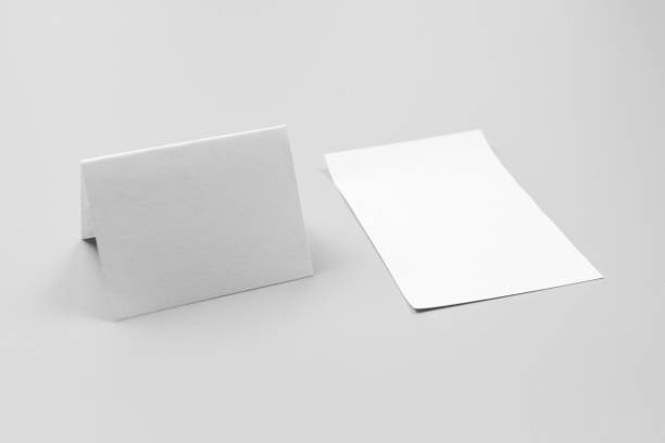 istock Blank portrait mock-up paper. brochure magazine isolated on gray, changeable background / white paper isolated on gray 970809492