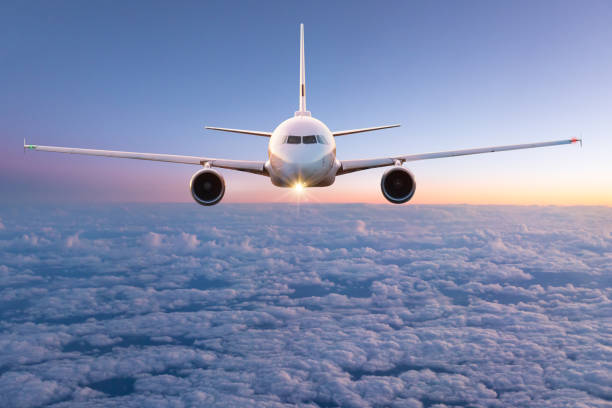 istock Commercial airplane flying above clouds 970809836