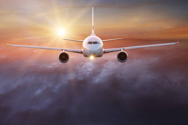 istock Commercial airplane flying above clouds 970809896