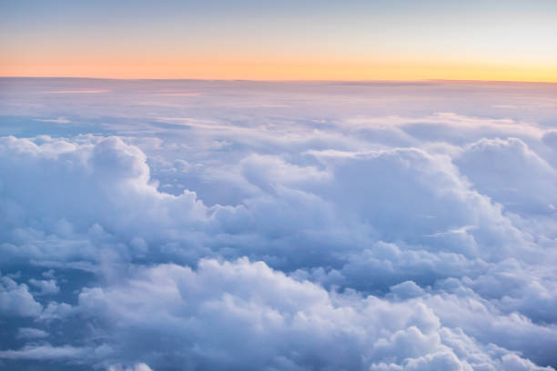 istock Beautiful sunset with cloudy sky from the airplane window 970812538