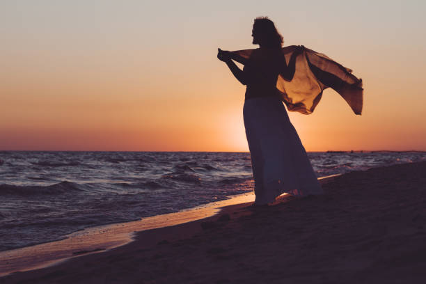 istock Woman on the beach in the summer 970815738