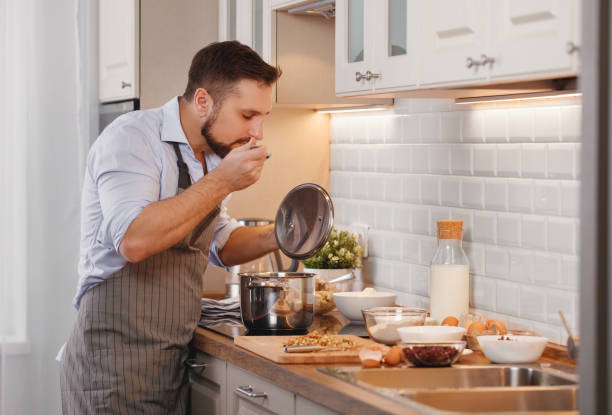 man cooks baking   cookies at home