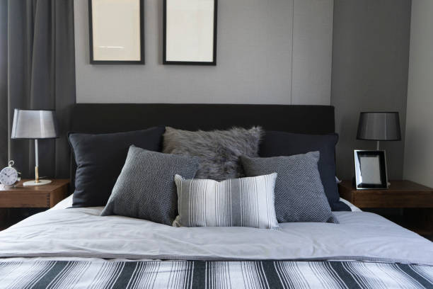 istock bedroom with picture frame on walls with two grey pillows 970823000