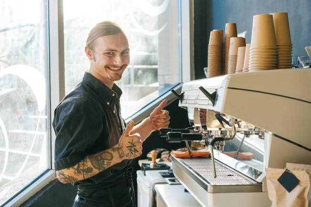 istock Barista brewing coffee with coffee machine 970828148