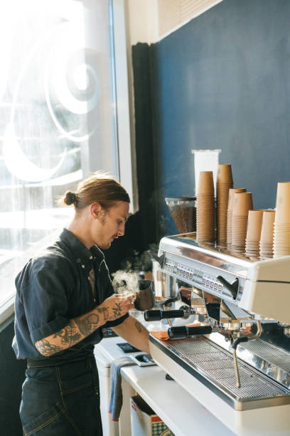 istock Barista brewing coffee with coffee machine 970828274