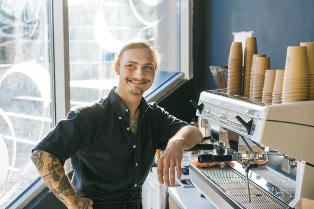 istock Barista brewing coffee with coffee machine 970828970