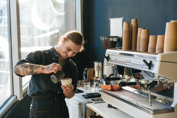 istock Barista brewing coffee with coffee machine 970829038