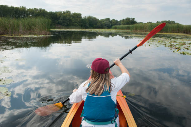 istock Girl in a kayak on a river 970835752