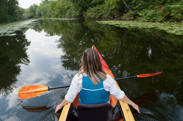 istock Girl in a kayak on a river 970836710