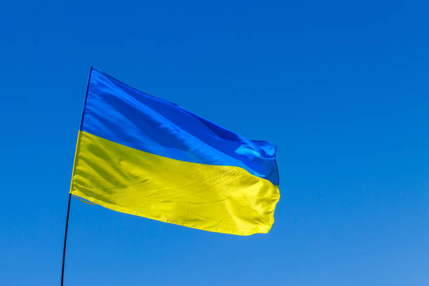 istock Blue-yellow flag of Ukraine on blue sky background 970836720