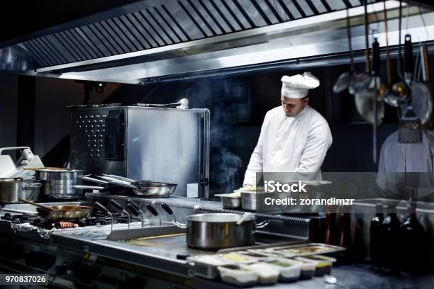 Chef Working On The Kitchen Stock Photo - Download Image Now - Commercial Kitchen, Kitchen, Restaurant