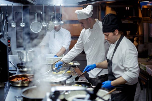 istock Group of chefs working in the kitchen 970840674