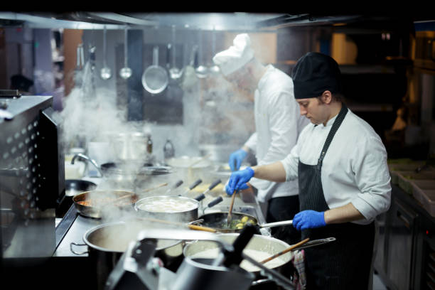 istock Group of chefs working in the kitchen 970843116