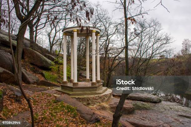 Sightseeing White Rotunda Or Round Gazebo On Granite Rocks And Stones On Background Of The Rainy Sad Autumn Landscape Photo To Transfer Melancholic Mood Or For Anyone Who Loves Autumn Tourist Trips Stock Photo - Download Image Now