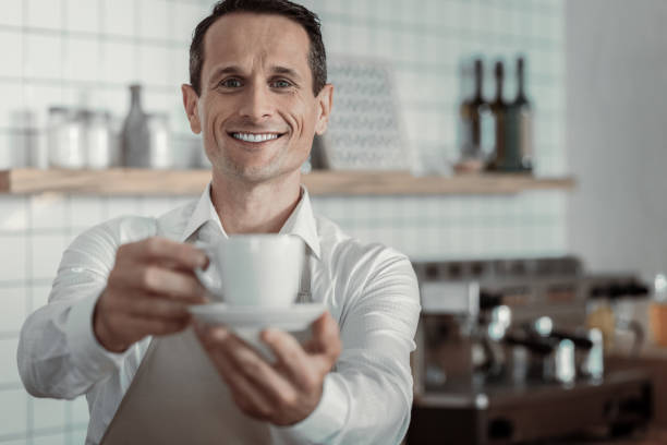 istock Delighted owner working in his coffee shop 970852986