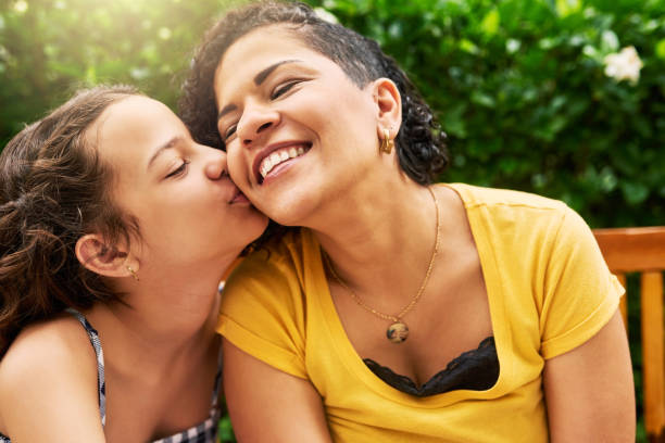istock Kisses for mom! 970856952